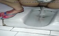Indian girl peeing in public bathroom