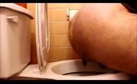 Hairy guy poops in toilet
