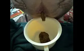 Man Poops in a White Bucket