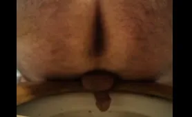 Man drops a nasty yellow poop