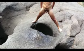 Man Poops and Pisses in a Natural Hole