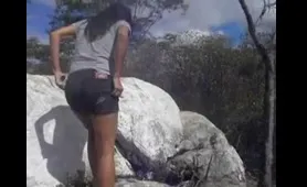 Woman Shits on Rocks