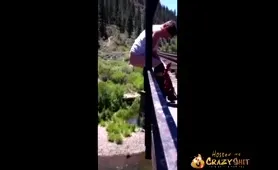 Man Shits from a Bridge