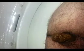 Hairy guy takes a nasty dump