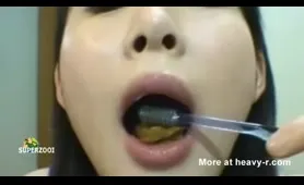 Asian Woman Brushes Teeth with Shit