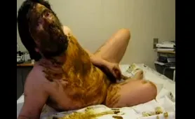 Bearded dude smears himself with Shit