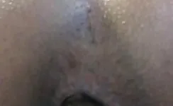 Shaved babe pushing big turd