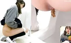 Dark haired beauty shitting