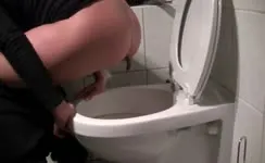 She's pooping over toilet