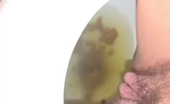 Hairy babe shitting and peeing