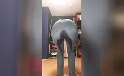 Wet her blue jeans