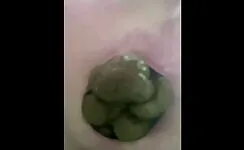 Lady pooping hard green poop 