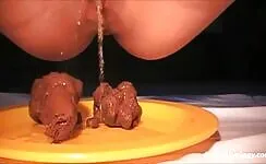 Naughty girl with shaved pussy pooping and pissing on the plate 