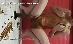 Slut fucking her ass with dildo while smearing 