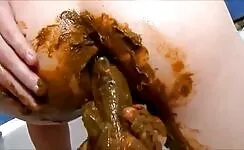 Girl shitting and masturbating with big dildo