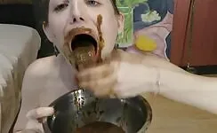 Eating her chocolate shit 
