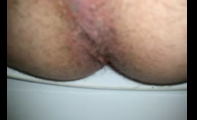 Hairy woman shows off her nice Ass in close up