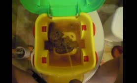 Babe Shits and Pisses on a Toy