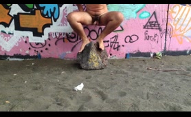 Woman Pisses and Shits on the Sand