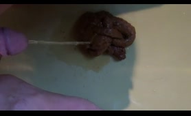Woman pisses on a pile of Shit