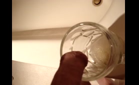 Woman Fills a Glass with Piss