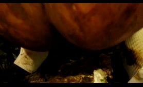 Woman drops a filthy load in a dirty place