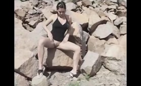 Wild Woman Pees on Rocks