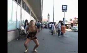 Babe pisses at the bus stop