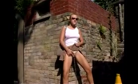 Babe Pees in a Courtyard