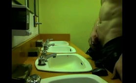 Guy Takes a Piss in the Bathroom