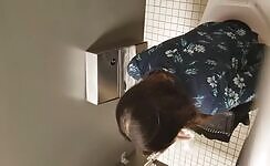 Asian lady caught pooping in the toilet 
