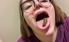 Cute nerdy babe eating her turd 
